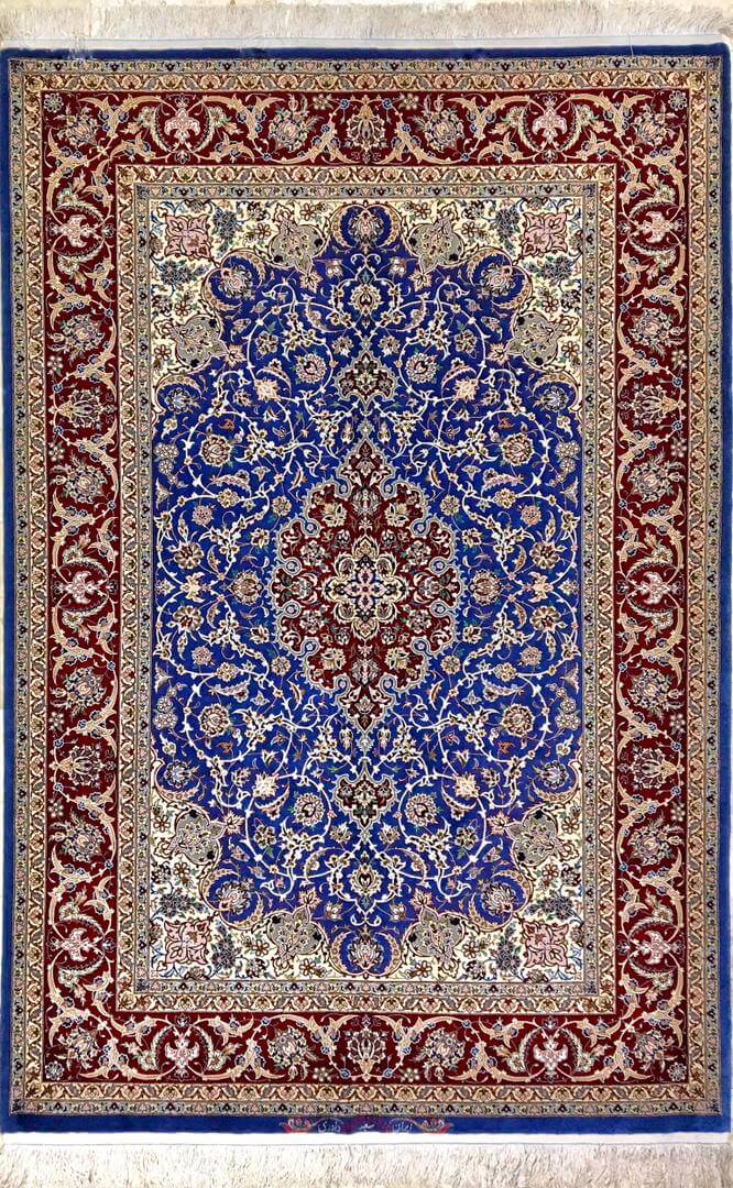 "Authentic Isfahan Persian rug, handwoven by Saieed Davarie, featuring a stunning blue medallion design."